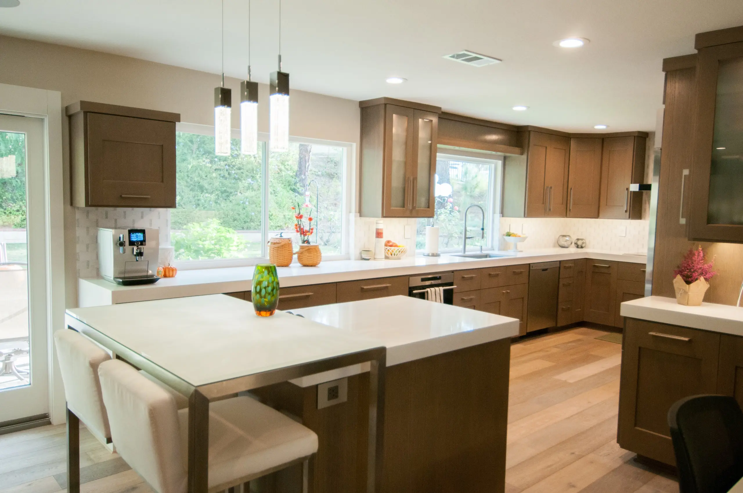 Open-concept wood kitchen with island seating in Irvine